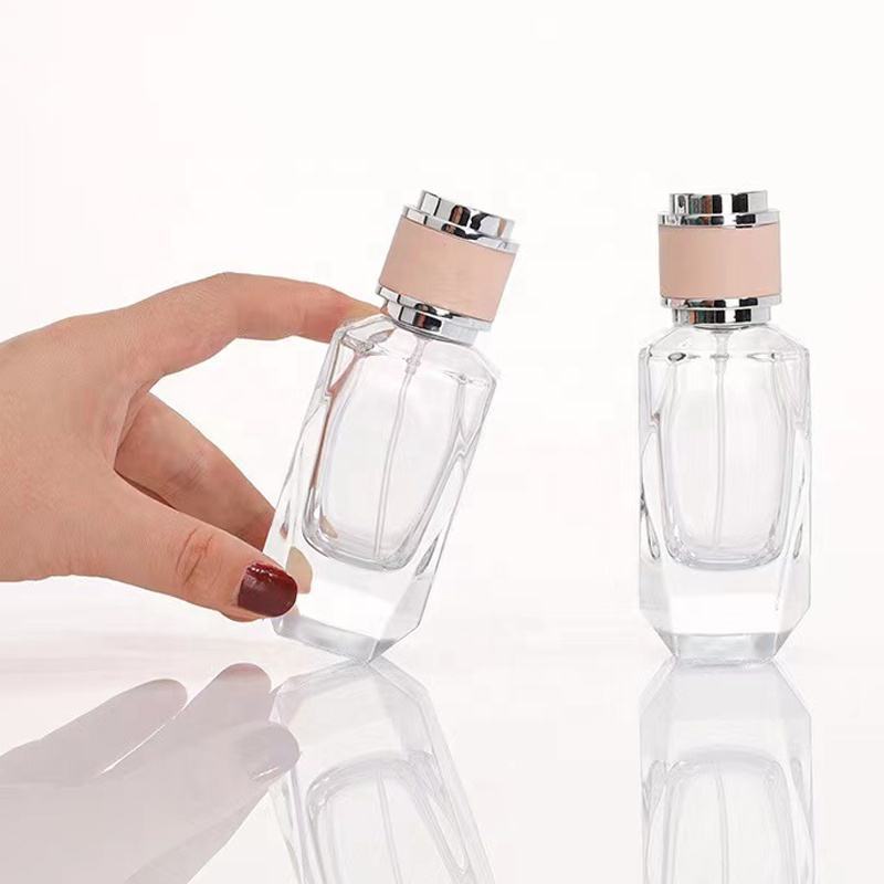 Factory direct wholesale High quality 50ml Empty Unique Shape Luvury Perfume Glass Bottle with Pink Cap