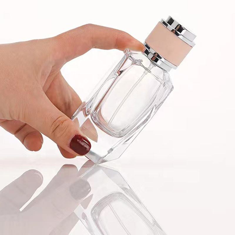 Factory direct wholesale High quality 50ml Empty Unique Shape Luvury Perfume Glass Bottle with Pink Cap