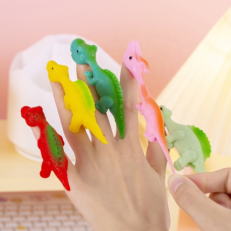 2024 new wholesale arrive flying dinosaur fingers squishi stress slingshot dinosaur flying games dinosaur kids bite finger toys