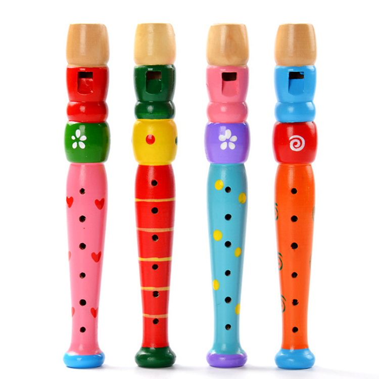 Early childhood development kindergarten learning to play musical instruments happy wooden flute