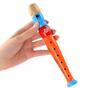 Early childhood development kindergarten learning to play musical instruments happy wooden flute