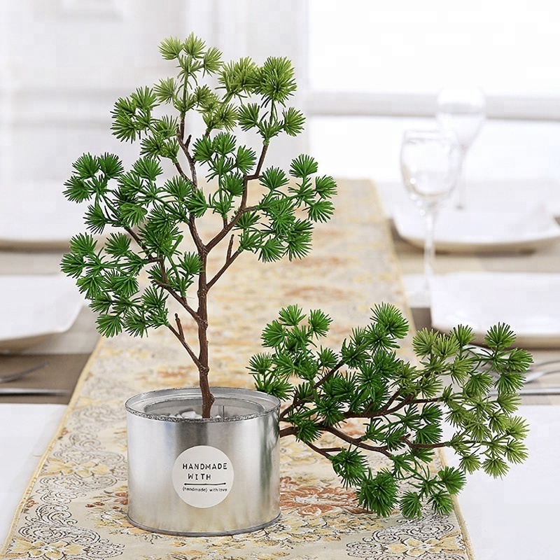 Short branches and small pine needles plastic flowers and artificial plant