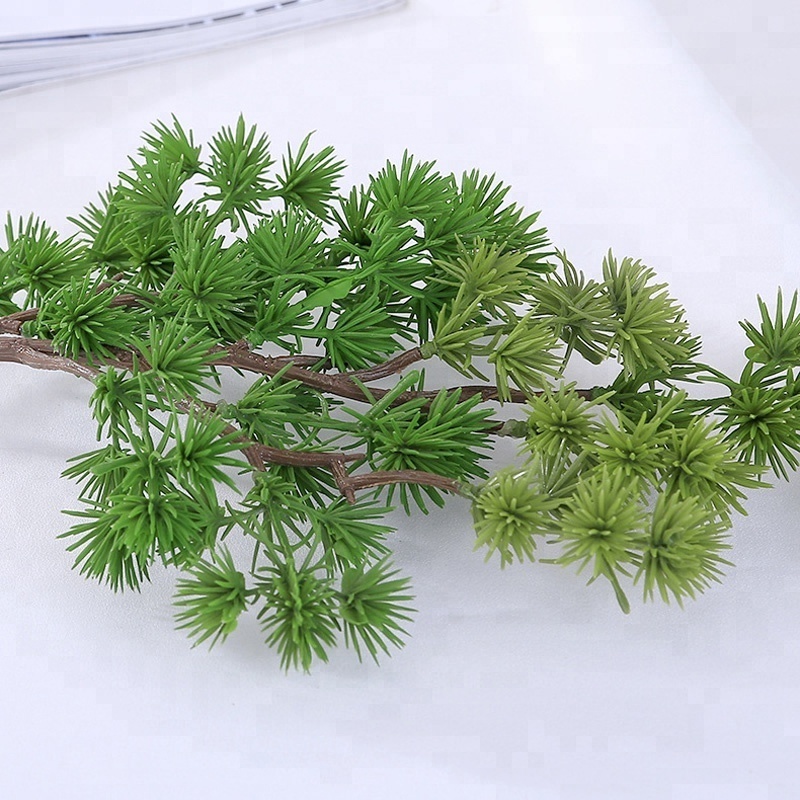 Short branches and small pine needles plastic flowers and artificial plant