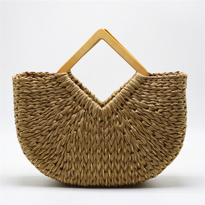 Wholesale straw woven handbag women half moon handheld handmade beach bags