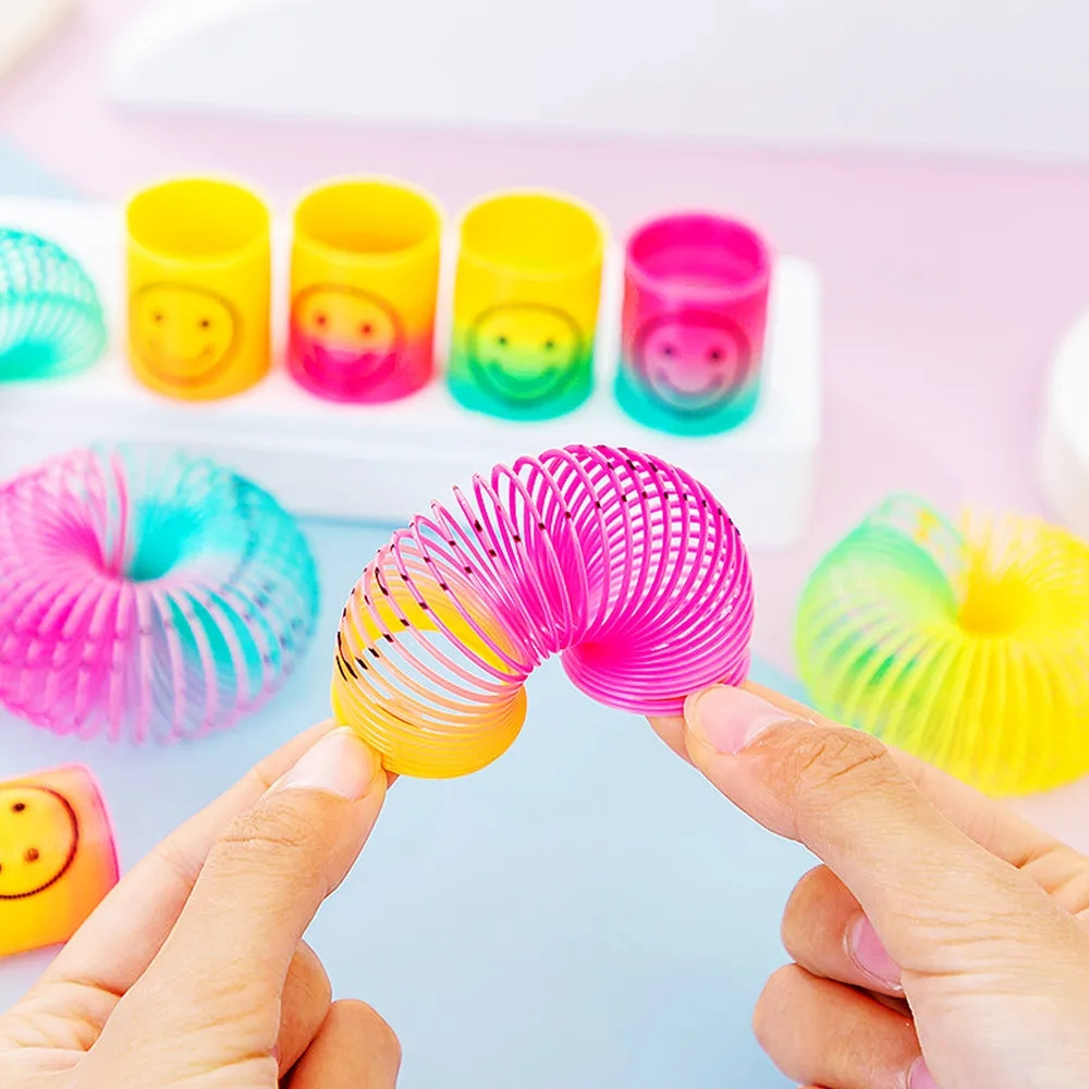 12Pcs Rainbow Smile Magic Springs Circle Toys for Children Birthday Party Favors Giveaway Gifts