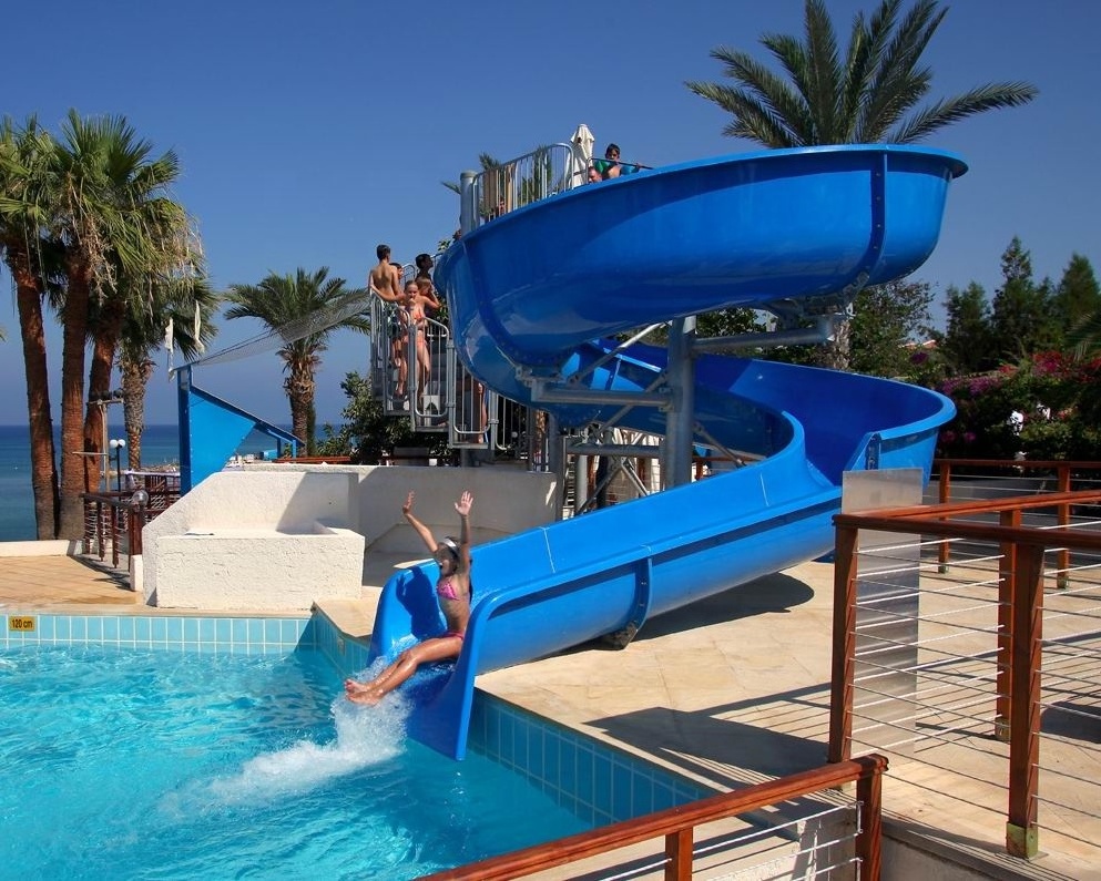 Backyard hard pool open spiral water slide