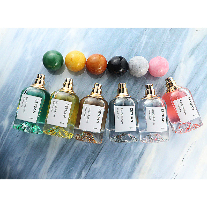 50ml Luxury Dubai round clear perfume bottle crimp sprayer glass snow mountain bottom with resin ball lid