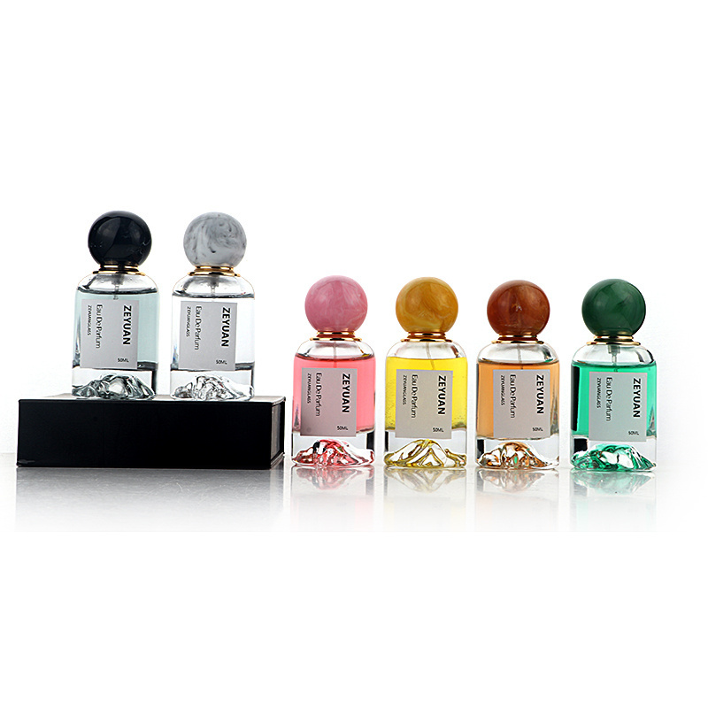 50ml Luxury Dubai round clear perfume bottle crimp sprayer glass snow mountain bottom with resin ball lid