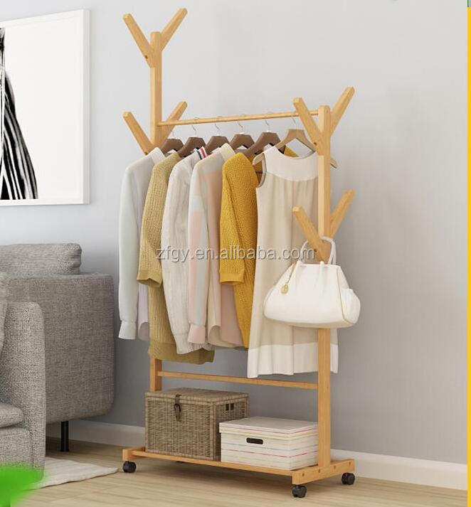 Freestanding wooden clothing store display rack with wheels