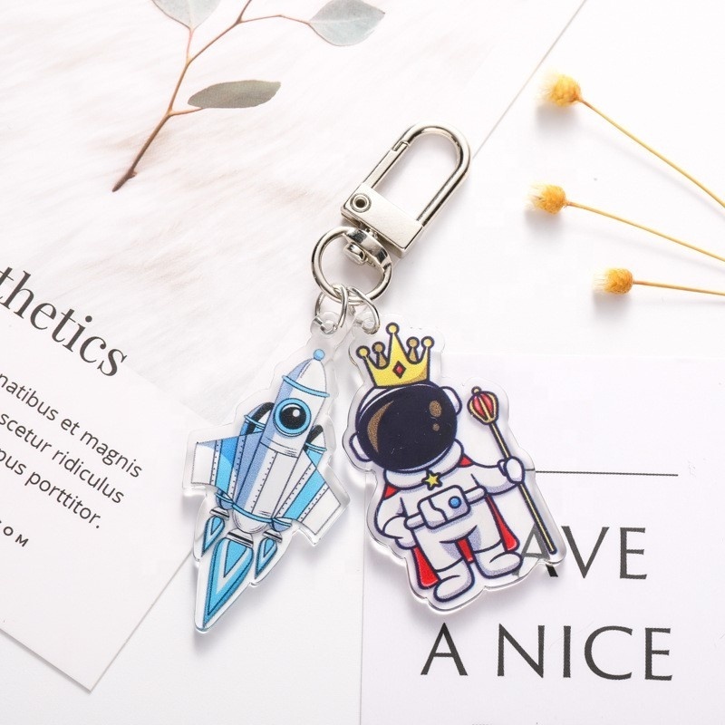 Creative astronaut astronaut plastic key chain cute cartoon headphone cover pendant new car key chain