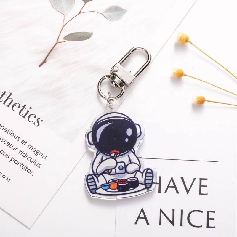 Creative astronaut astronaut plastic key chain cute cartoon headphone cover pendant new car key chain