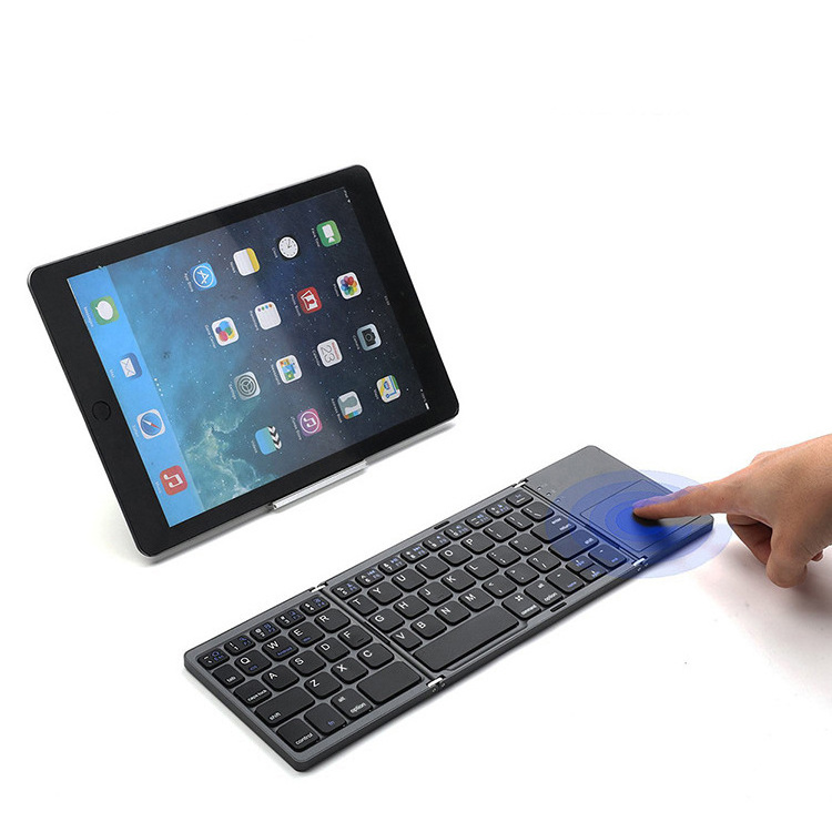 Hot Sale Slim Wireless Bluetooths Keyboard Ultra Thin Foldable Keyboard for Touchpad Tablet PC Portable Mini Folding Keyboard