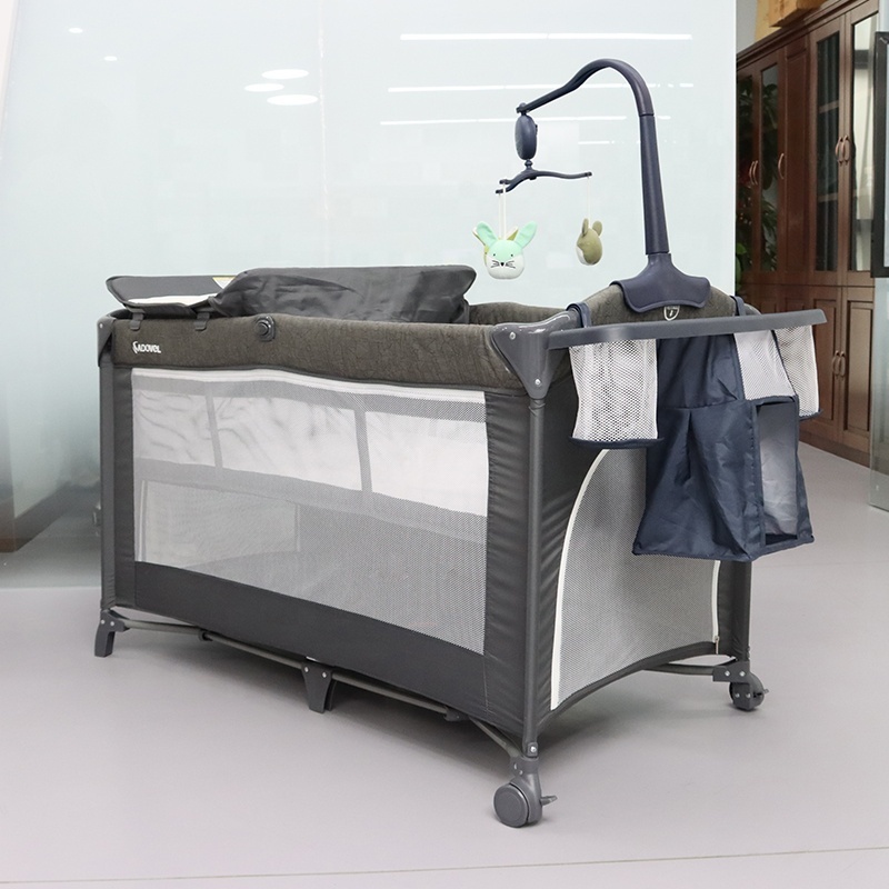 Manufacturer in stock multifunctional movable baby crib with diaper table Foldable travel game bed with wheels baby products