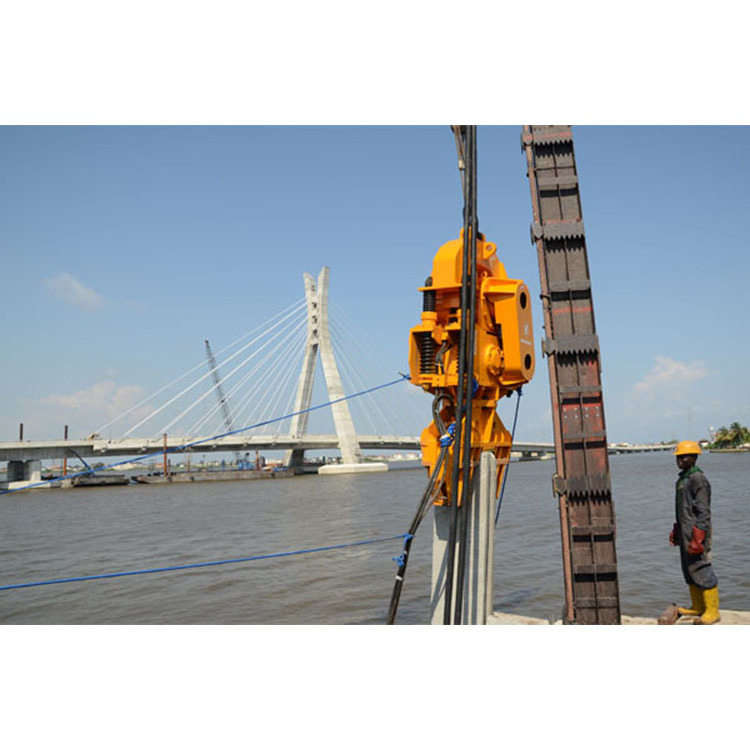 Crane mounted electric vibratory hammer pile driver for concrete pile