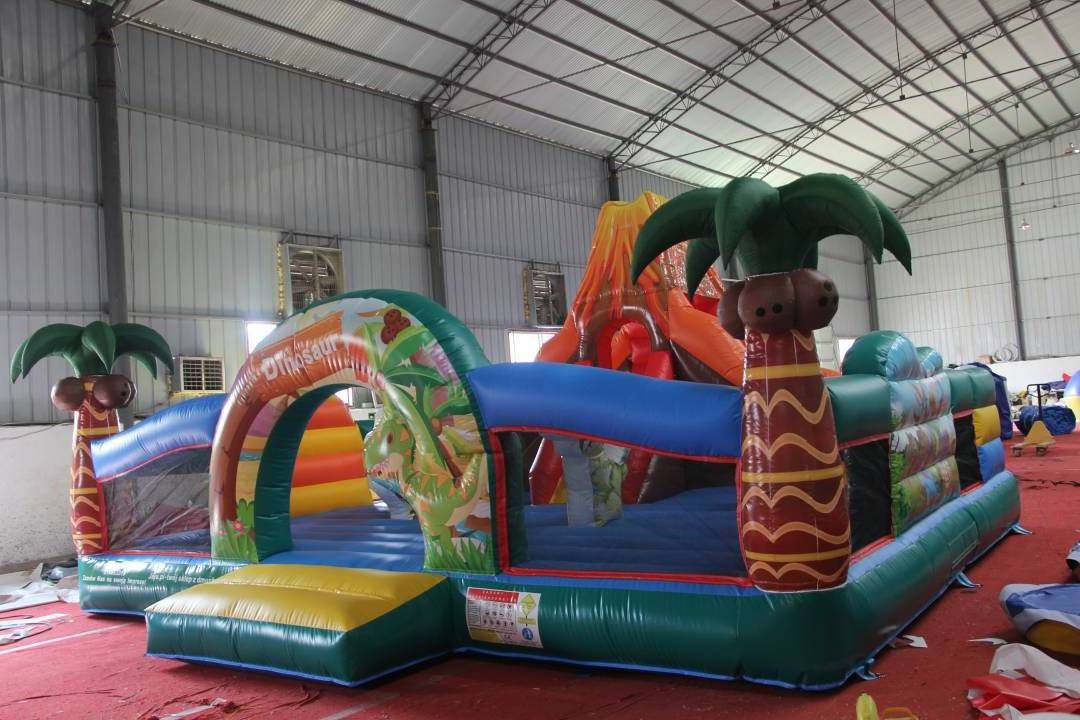 Inflatable Jurassic Giant Dinosaur Park Kids Jumping Bouncy Castle With Slide Palm Tree Commercial Inflatable Jumping Castle